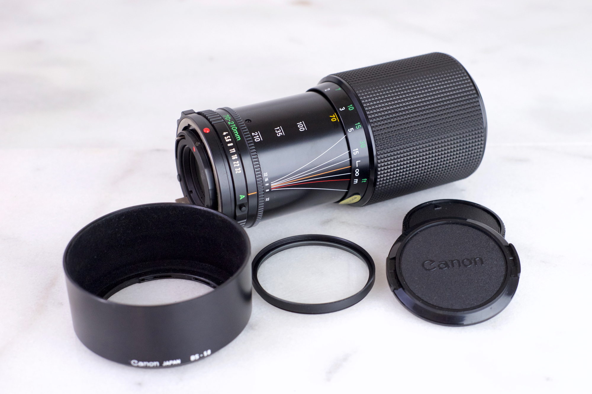 Canon Zoom Lens FD 70-210mm F/4 with Caps, UV Filter and Lens Hood- Macro  Focusing Legacy Lens for FD Mount Canon Cameras — F Stop Cameras